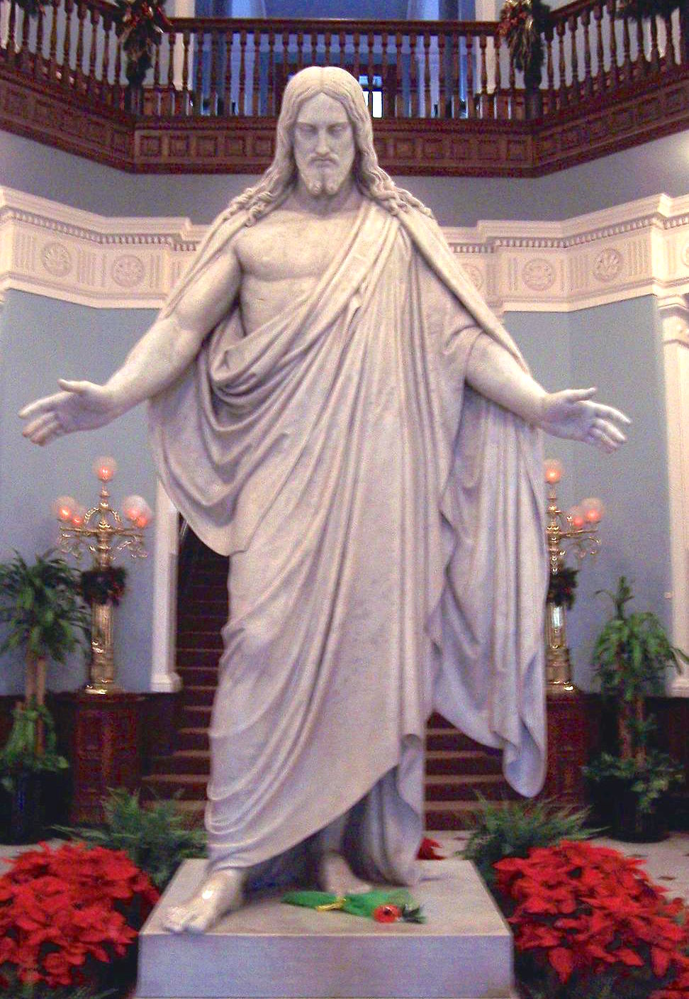A white marble Christ stands with open arms beneath the rotunda of Johns Hopkins Hospital.